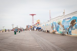 Coney Baloney: Will Big Developers Ever Build Their Dreamlands in Coney Island? Coney Island boardwalk still features the landmarked Parachute Jump. (Photo: Kaitlyn Flannagan for Observer.)