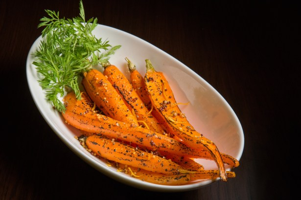 The Secret of a Steakhouse Thriving in NYC? Forget the Steak. butcher banker carrots by pap studio The Secret of a Steakhouse Thriving in NYC? Forget the Steak.